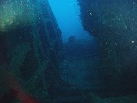 The wreck is not completely upside down but almost. The top hamper is crushed and smashed across the seabed...