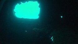 Light from the outside pours through a hatch in the starboard side of the wreck...