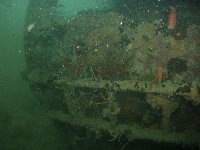 The funnel of the Olympia Maru has fallen on to it's side on the deck...