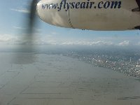 Flying out over Manila Bay in a 19 seat Dornier prop jet bound for Busuanga...