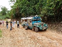 Despite having all terrain tyres our jeepney got a flat on the unmade jungle road...