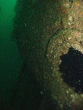 Is this a hawse hole for the anchor chain under the overhang of the hull?