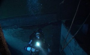 TJ ascends from a lower section of the wreck - in reality she is moving towards the starboard side of the ship...